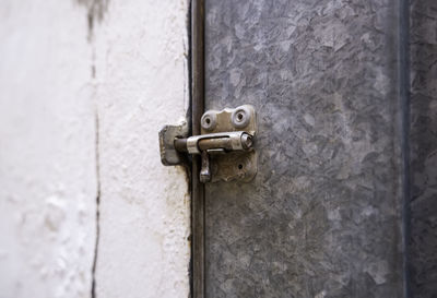 Close-up of door handle on wall