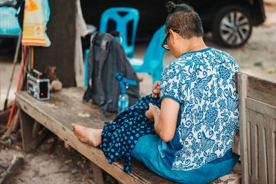 Rear view of couple sitting on seat