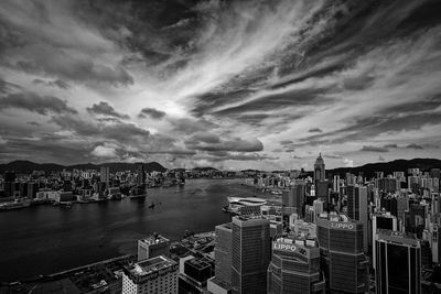 High angle view of harbor against cloudy sky