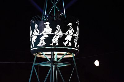 Low angle view of illuminated electric lamp