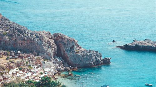 High angle view of rocks on sea