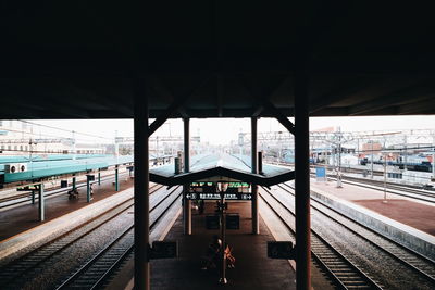 Railroad station platform under bridge at station