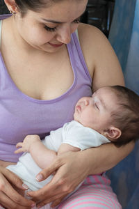 High angle view of mother and daughter at home