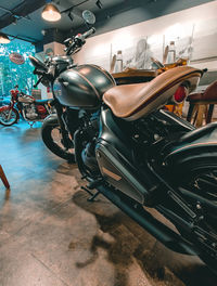 Bicycles parked in illuminated city at night