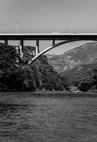 Bridge over river against sky