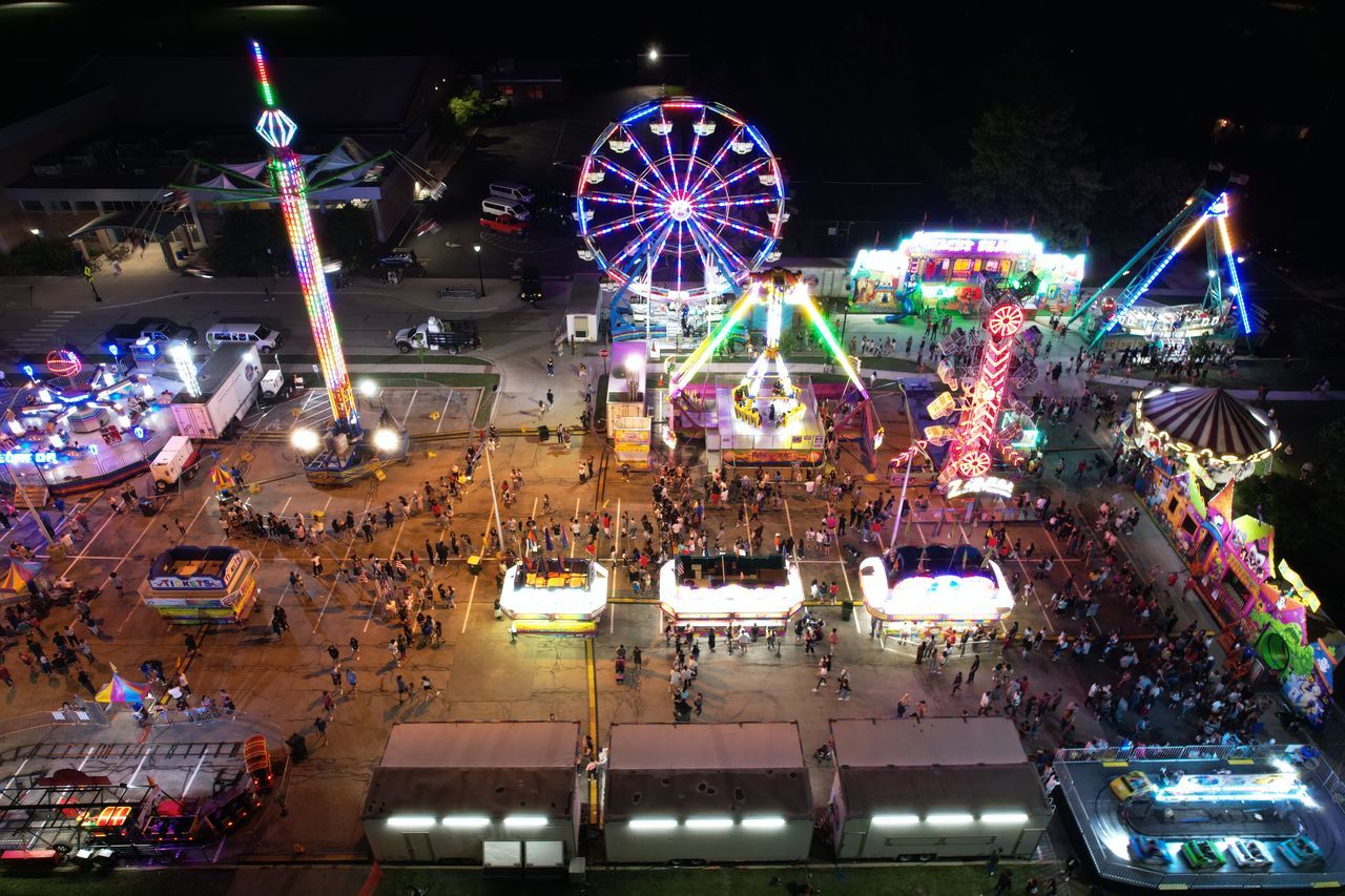 HIGH ANGLE VIEW OF FERRIS WHEEL AT NIGHT