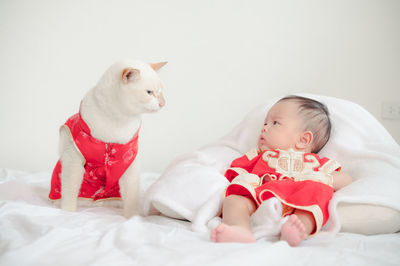 Cute baby girl lying on bed