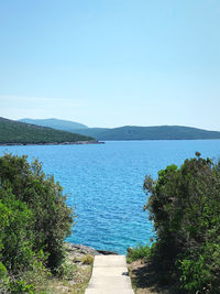 Scenic view of sea against clear blue sky