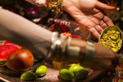 Close-up of person preparing fruits