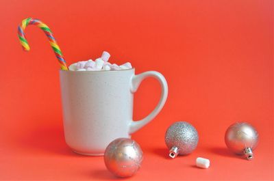 Close-up of drink against red background