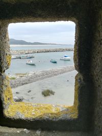 Scenic view of sea seen through window