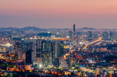 Illuminated cityscape at night