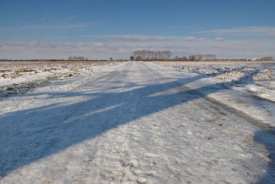 Scenic view of snow field against sky