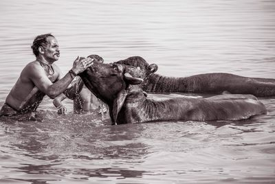 Midsection of man in lake