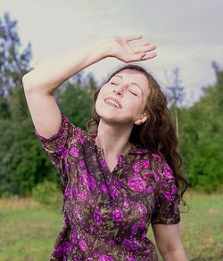 Portrait of a beautiful young woman with eyes closed