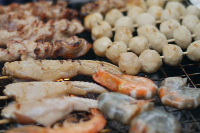 Close-up of meat on barbecue grill