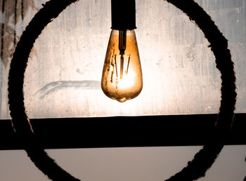 Close-up of illuminated light bulb
