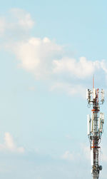 Low angle view of communications tower against sky