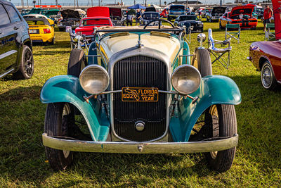 Vintage car parked on field