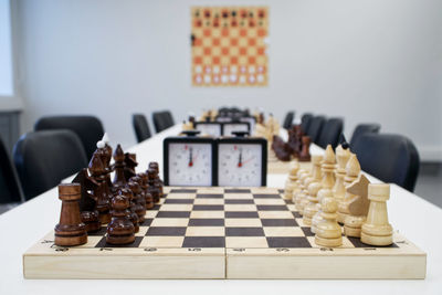 Close-up of chess pieces on table