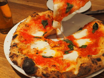 Close-up of pizza served on table
