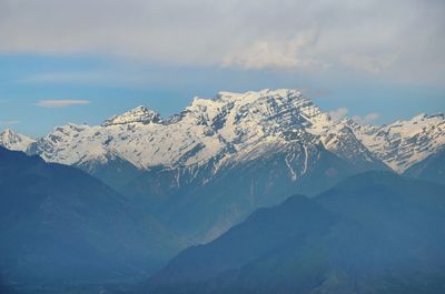 Scenic view of snowcapped mountains against sky