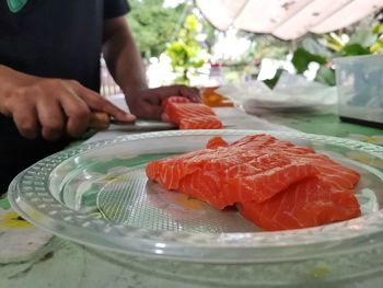 Midsection of man preparing food