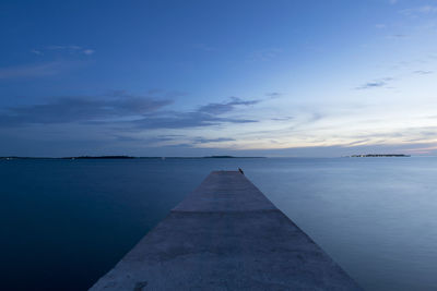 Scenic view of sea against sky at sunset