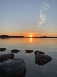 Scenic view of lake against sky during sunset