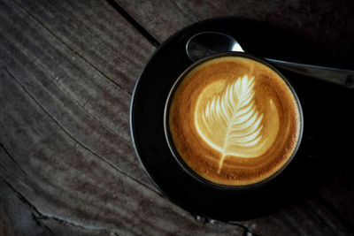 High angle view of cappuccino on table