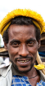 Close-up portrait of smiling young man