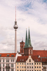 View of tower against cloudy sky