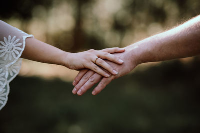 Cropped hand of woman holding hands