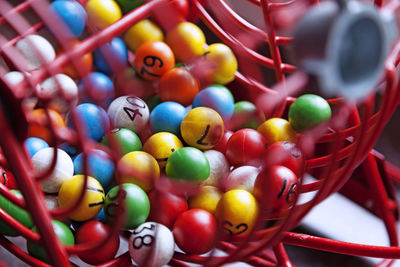 High angle view of multi colored candies in container