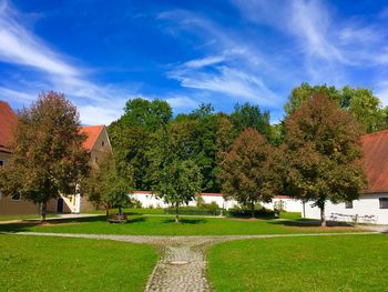 Trees on field against sky during autumn