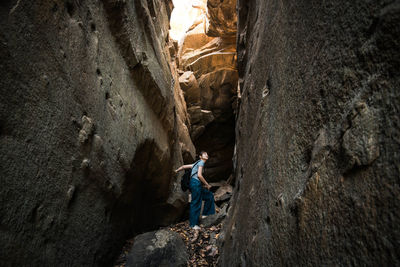 Side view of man on rock