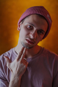 Portrait of young man wearing hat