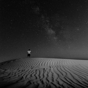 Scenic view of landscape against sky at night