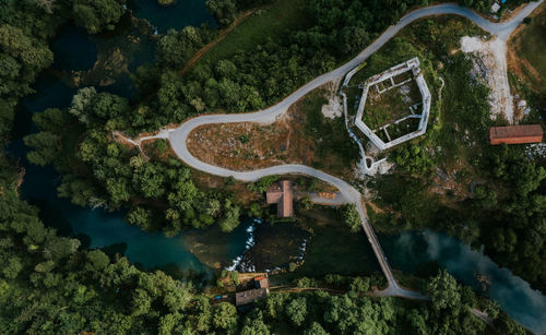 High angle view of bridge over river amidst trees