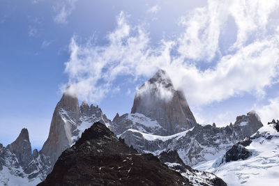 Panoramic view of snowcapped mountains against sky