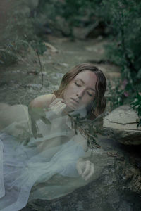 Portrait of a young woman in water