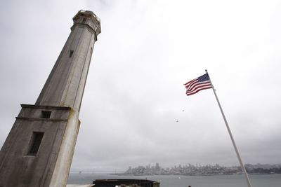 Low angle view of flag against sky