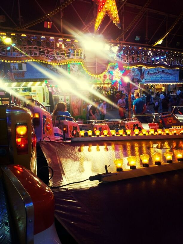 illuminated, night, city, food and drink, multi colored, retail, incidental people, lighting equipment, market stall, food, market, high angle view, abundance, variation, large group of objects, for sale, city life, store, choice, outdoors