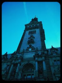 Low angle view of church against blue sky