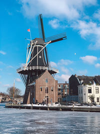 Traditional windmill against sky