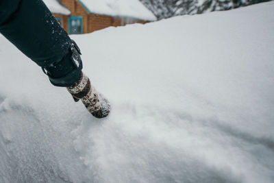 Low section of man on snow