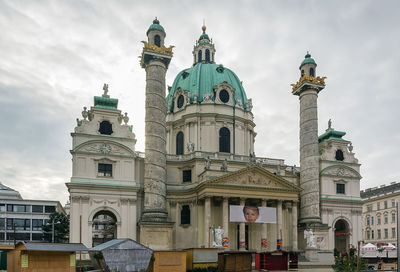 View of buildings against cloudy sky