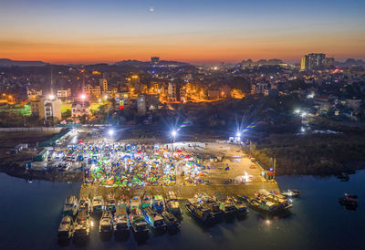 High angle view of illuminated buildings in city at night