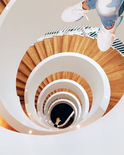 Low section of man on spiral staircase