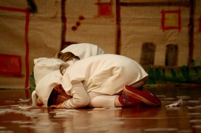 Boy wearing hat on floor